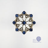 renaissance pin sapphire and starburst pearl pin