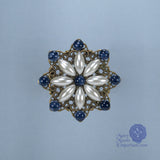 renaissance pin sapphire and starburst pearl pin