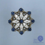 renaissance pin sapphire and starburst pearl pin