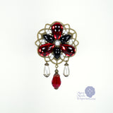 Baroness Ladonna red Renaissance pin in bronze