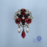 Baroness Ladonna red Renaissance pin in bronze