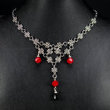 silver celtic knot necklace red crystal Torrin Red